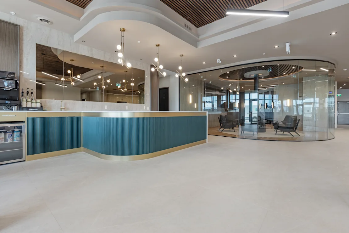 Curved reception desk beside the lobby bar