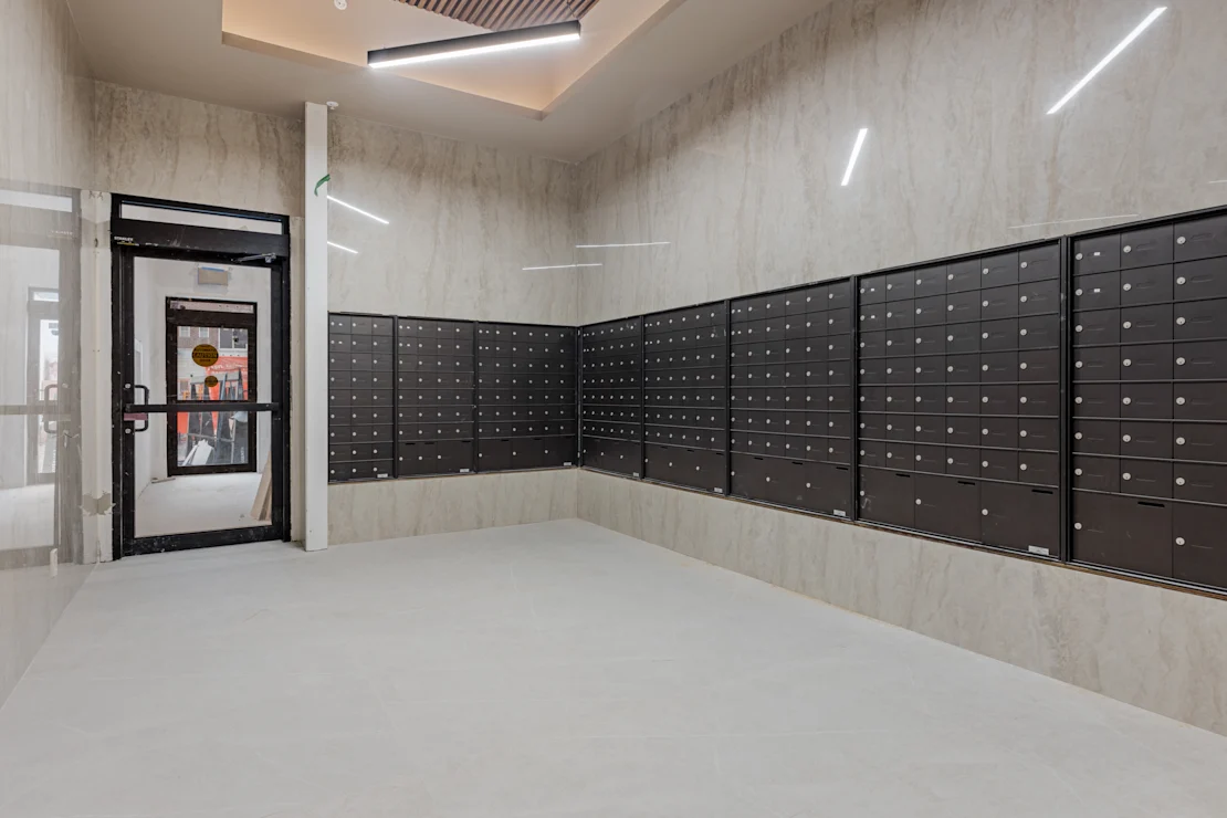 Parcel room lined with black lockers