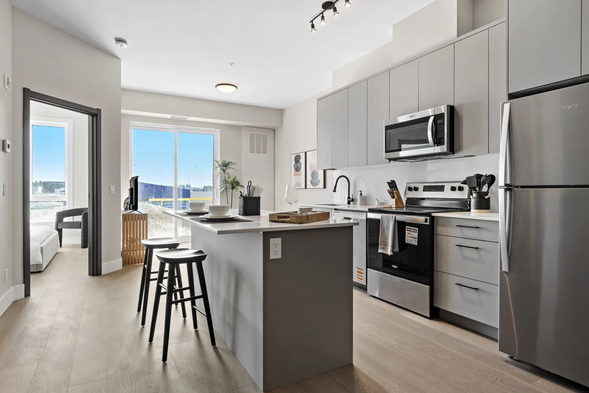 Kitchen with quartz counters and stainless steel appliances