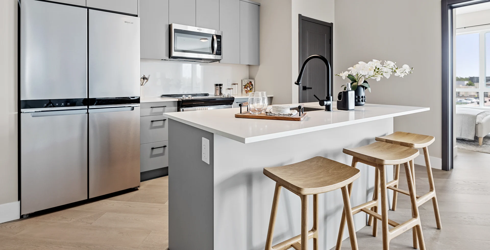 Suite kitchen with stainless steel appliances and upgraded cabinetry