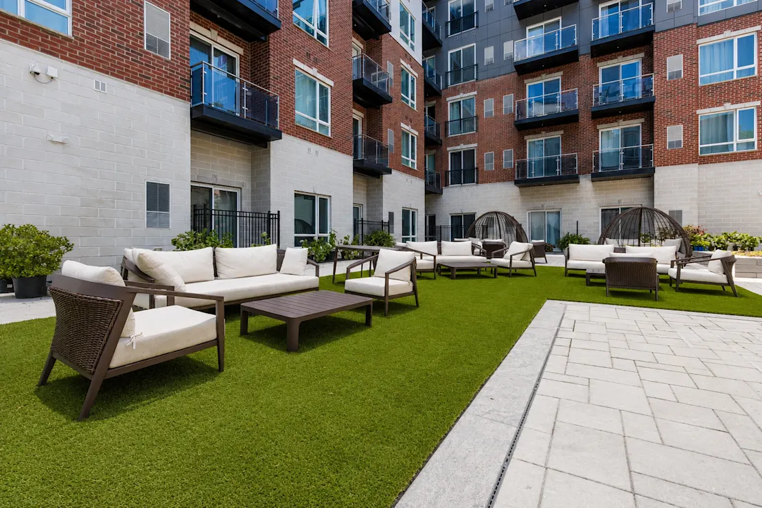 Terrace seating with a white couch on the lawn